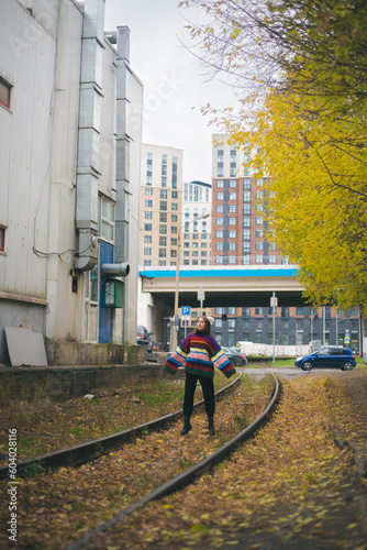 Wallpaper Mural Girl in sweater jumping on railroad Torontodigital.ca
