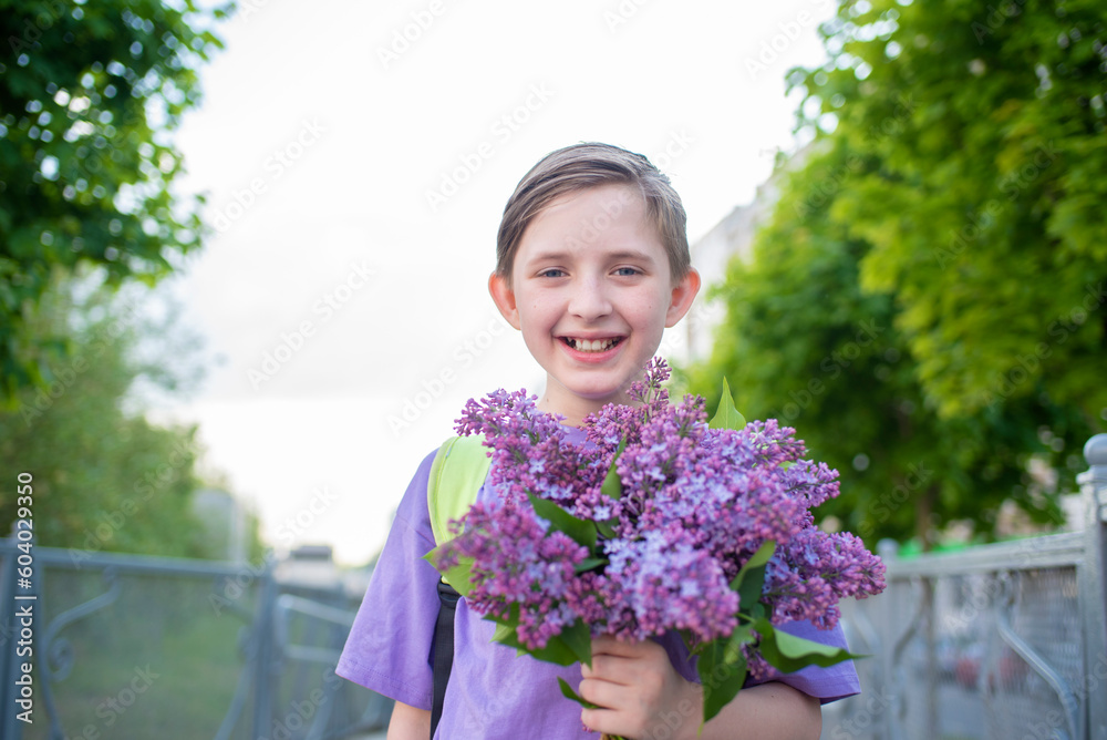 boy, child, schoolboy holding a bouquet of lilacs in his hands boy, child, schoolboy holding a bouquet of lilacs in his hands