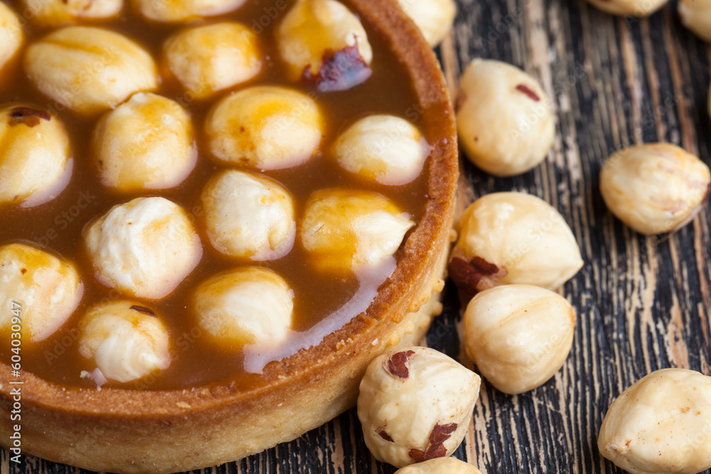 round tartlet with salted caramel and roasted hazelnuts round tartlet with salted caramel and roasted hazelnuts