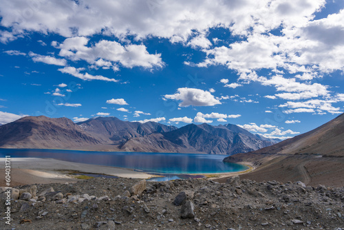 Mountains and Pangong tso (Lake). It is huge lake in Ladakh, altitude 4,350 m (14,270 ft). It is 134 km (83 mi) long and extends from India to Tibet. Leh, Ladakh, Jammu and Kashmir, India