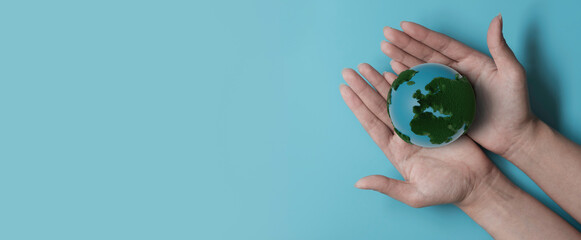 Hands holding 3D render earth, save planet, earth day, sustainable living, ecology environment, climate emergency action, world environment day concept, illustration for global warming content	