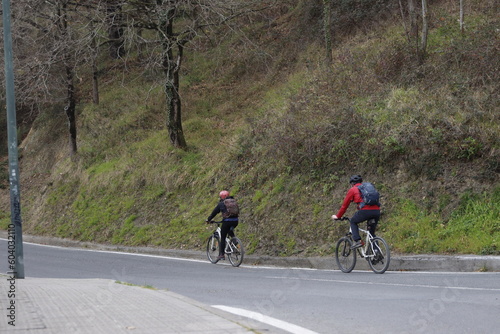 People riding a bicycle