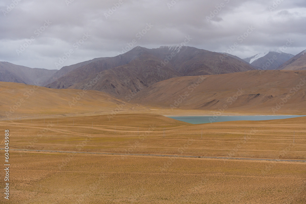 Landscape of Desert mountains against clouds sky at the way from Pangong Lake to Tso Moriri, Leh, Ladakh, Jammu and Kashmir, India