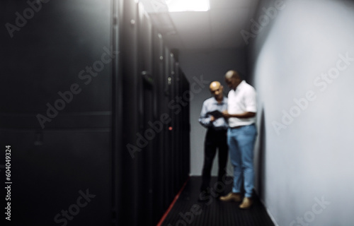 Server room, men or blurry technicians on technology together for cybersecurity glitch with teamwork. Coding IT support code, collaboration or African engineers fixing network for information tablet