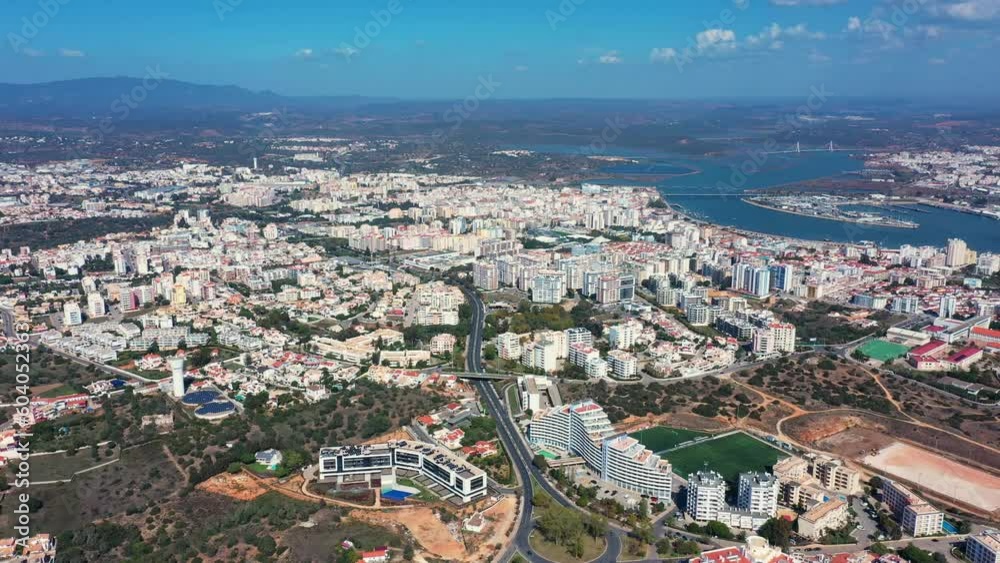 Tourist Portuguese city of Portimao aerial view on a sunny day. South Portugal Algarve. inner part of the city Tourist Portuguese city of Portimao aerial view on a sunny day. South Portugal Algarve. inner part of the city
