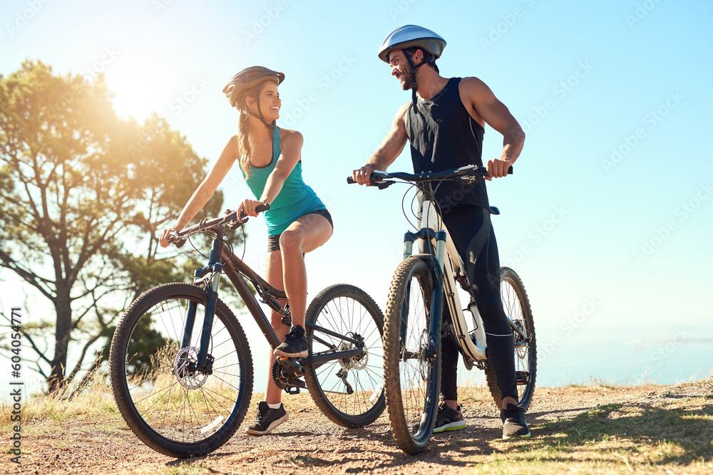 Couple, morning cardio and cycling in the mountains for fitness and exercise together. Bike, wellness and young people with outdoor adventure and sports training with happiness and freedom in sun