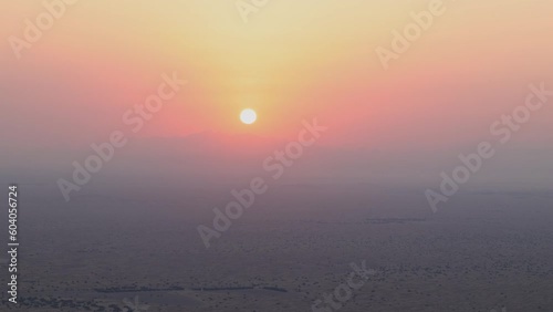 Sunrise over the Arabian Rub' al Khali Empty Quarter desert near Dubai in the United Arab Emirates photo