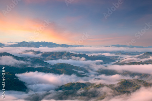 Aiyerweng sea of mist  with the mountains during sunrise time. The largest and most beautiful mist in the south of Thailand , Aiyerweng , Betong district , Yala province Thailand. photo