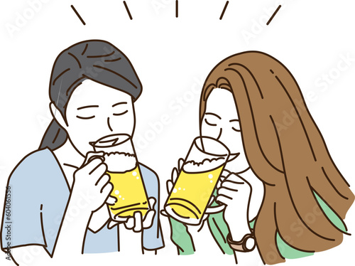 笑顔でビールを飲む若い女性たち
