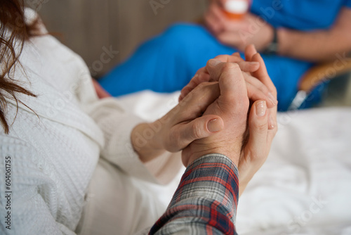 Couple giving helping hand to each other indoors