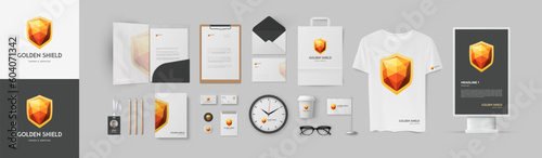 Premium corporate branding with golden shield logo and grey background. Lux stationery design template.