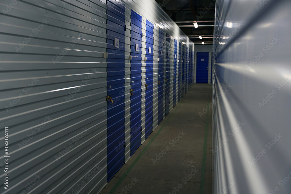 Warehouse storage indoors with self-storage unit, long corridor Warehouse storage indoors with self-storage unit, long corridor