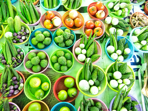 Fototapeta Naklejka Na Ścianę i Meble -  There are many types of Thai local vegetables that you can choose from such as kaffir lime, lemon, okra, cucumber, eggplant, tomato, bitter gourd and many more.in a variety.There are many uses in Thai
