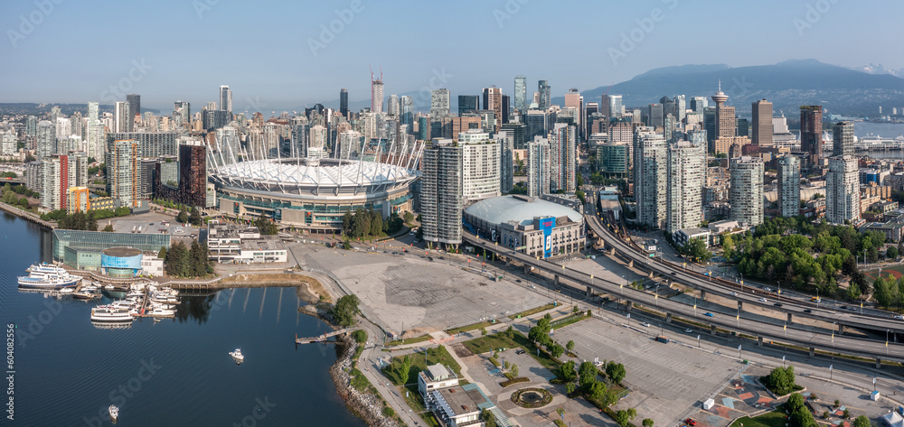 Vancouver, BC, Canada, aerial panoramic city view of famous False Creek in Vancouver downtown with Cambie Bridge and BC Place Stadium in front and Vancouver Skyline in the background 
