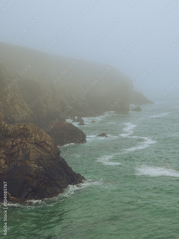 Foggy Caerfai Beach on the Pembrokeshire coast, Wales