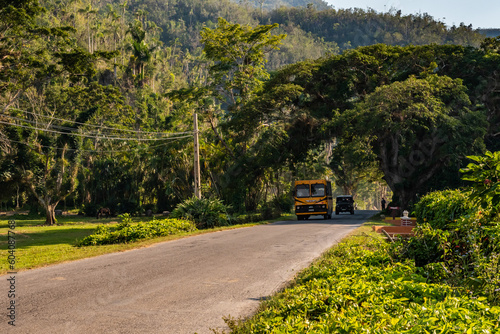 Old bus circulating in the countryside near Vinales in Cuba