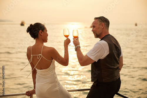 couple drinking orange juice in luxury yacht