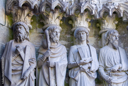 Sculptural images of the Holy Apostles on the wall of the facade of Saint Fin Barre's Cathedral in Cork, Ireland. The Apostles Andrew, James major, Thomas, Matthias.