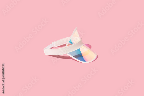 Quadro em tela Holographic sports visor hat on sunlight, pink background