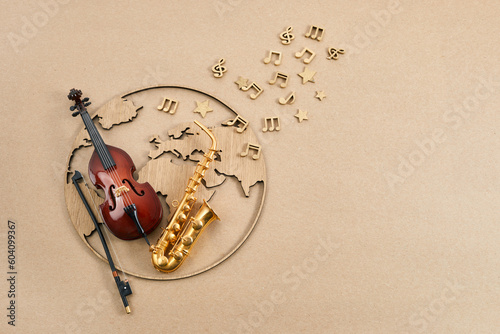 Canvas Print Happy world music day. Musical instruments with globe background.