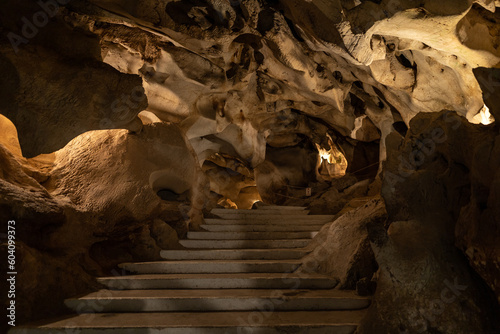 general horizontal contrapposto shot of the floor and ceiling of the rock formations of the cave of the treasure in Malaga photo