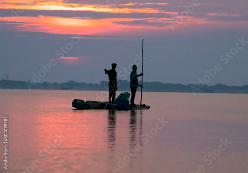 Photography Fishermen silhouette photo in a lake at early morning