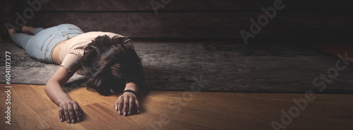 Unconscious young woman lying at home.