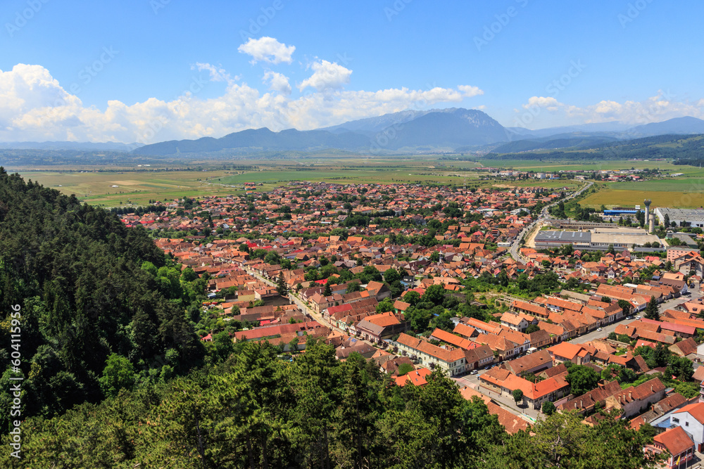 View of the city of Rasnov from a high point in the mountains of Transylvania. Romania
