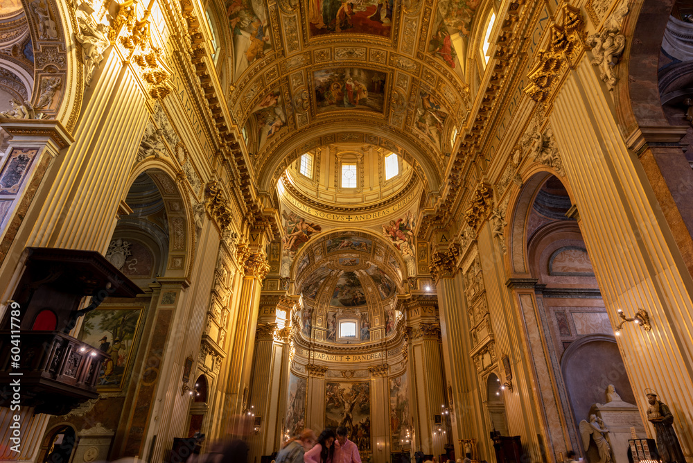 The internal side of the Church of Sant'Andrea della Valle in Rome in summer with Blurred People Silhouette