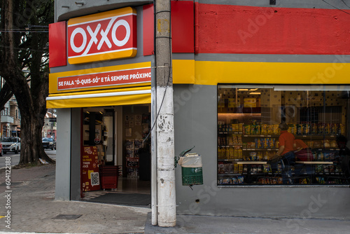 Fototapeta Naklejka Na Ścianę i Meble -  Sao Paulo, Brazil, April 29, 2023. Front view of Oxxo supermarket in Sao Paulo city. Oxxo is popular Mexican chain of grocery stores or convenience stores