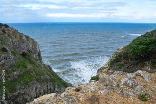 Panorama of the ocean coast and rock bay, Atlantic Ocean, beautiful cloudscape, dramatic landscape, colorful seascape with sheer rocks, travel content, Lisbon, Portugal