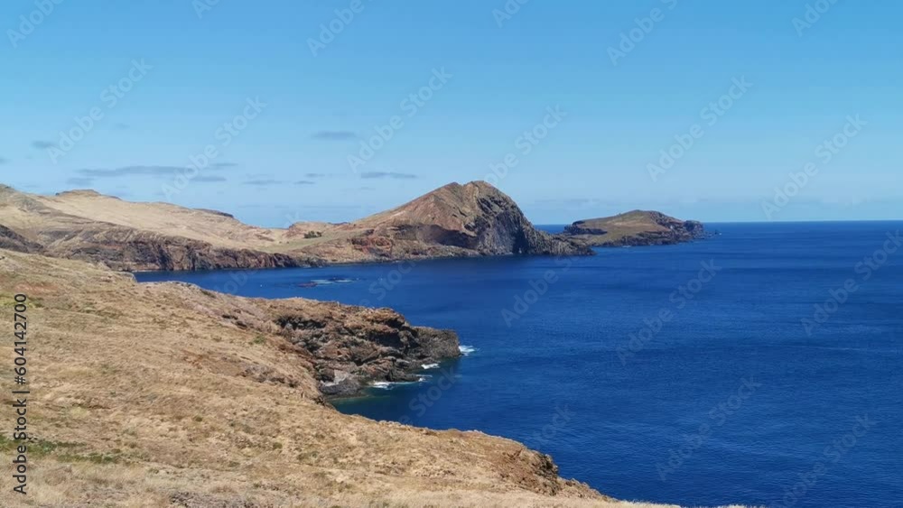 Amazing panoramic view at the huge natural island cliffs, St. Lourenço Cape or Cabo de São Lourenço, group of tourists hiking, on Madeira Island, Portugal Amazing panoramic view at the huge natural island cliffs, St. Lourenço Cape or Cabo de São Lourenço, group of tourists hiking, on Madeira Island, Portugal
