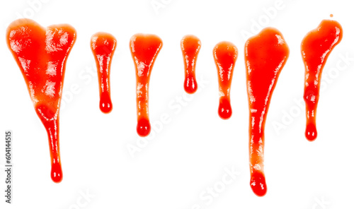 Red ketchup splashes isolated on white background, tomato puree texture