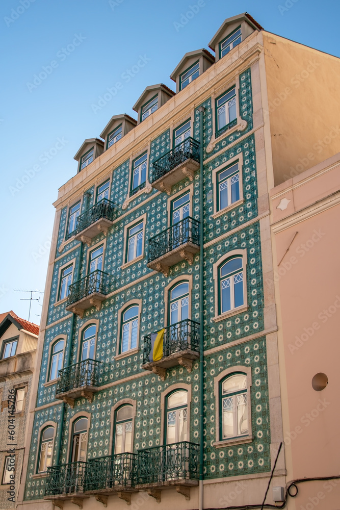 Facade of an old house with windows, European historical buildings, Lisbon, Portugal