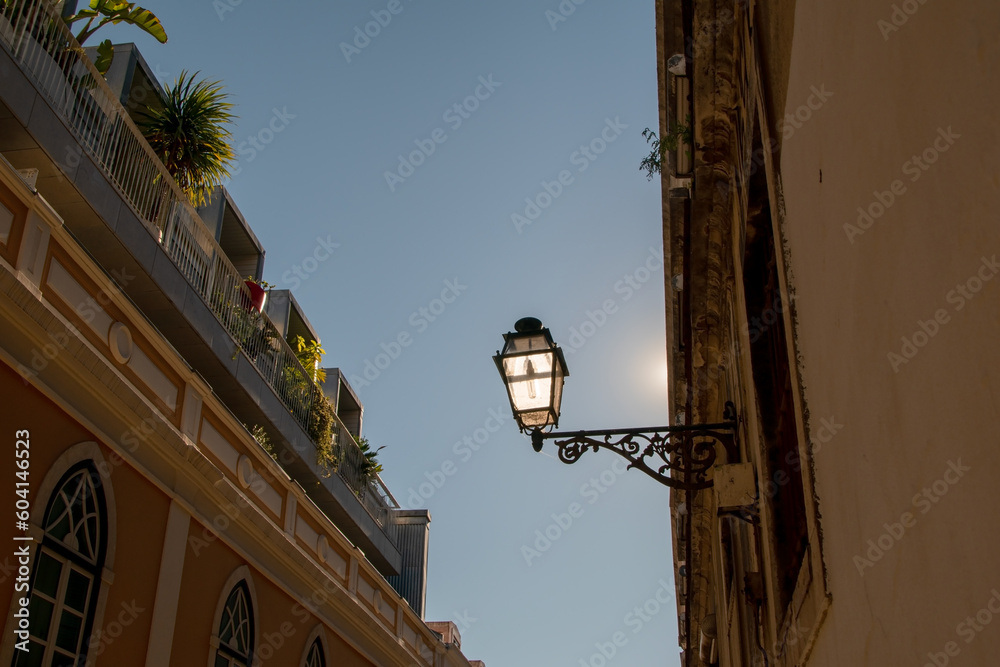 Streetlights, street lamp and facade of an old house with windows, European historical buildings, cozy cityscape, Portuguese streets landscape, view of city, Lisbon, Portugal