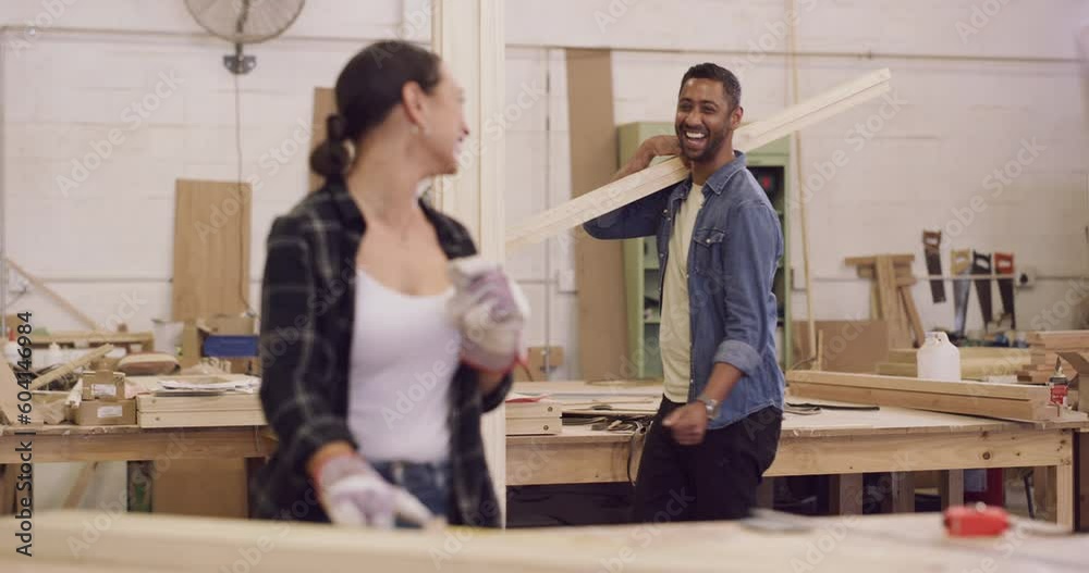 Wood work, woman and man in workshop dancing with wooden beams. Startup or small business, professional carpenter or builders and happy people construction workers dance at their workplace working Wood work, woman and man in workshop dancing with wooden beams. Startup or small business, professional carpenter or builders and happy people construction workers dance at their workplace working
