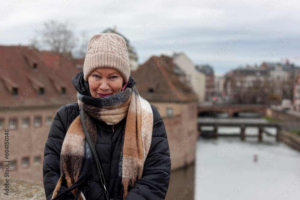 Portrait of mature beautiful woman on the embankment in Strasbourg Portrait of mature beautiful woman on the embankment in Strasbourg
