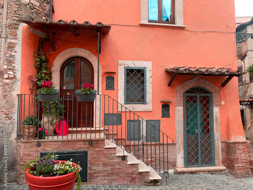 slow living in Italy, red vintage patio house