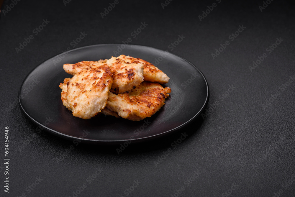 Delicious fried chicken meat chops with spices, salt and herbs