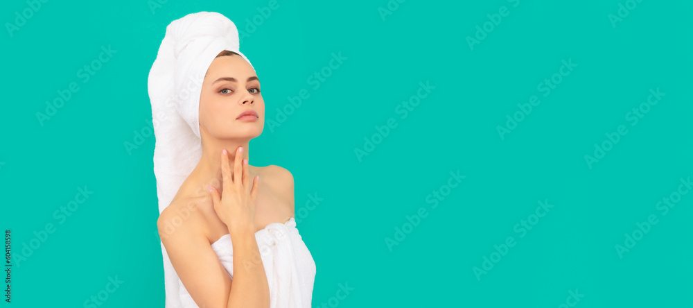 girl in towel with perfect skin on blue background. Beautiful woman isolated face portrait, banner with mock up copy space. girl in towel with perfect skin on blue background. Beautiful woman isolated face portrait, banner with mock up copy space.