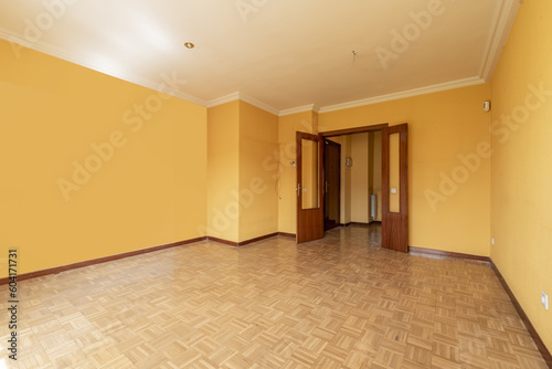 An empty room with a sapele wood double door with French windows photo
