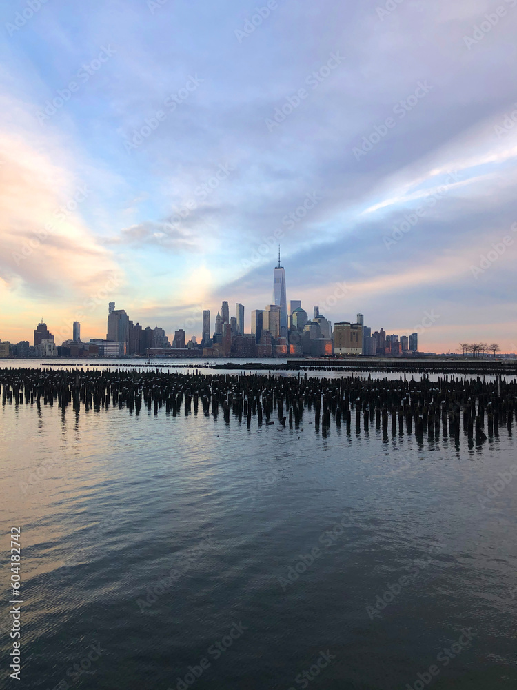 Manhattan skyscrapers view from the water, modern architecture of New York City landscape from the waterfront