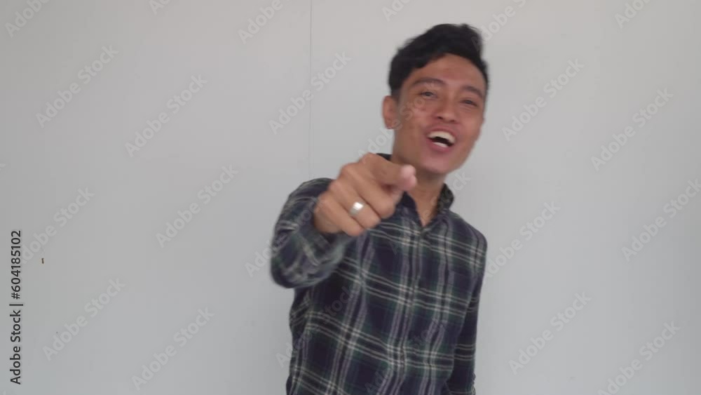 Young man Indonesia cheer and smile expression on day light with nature sky background. The footage is suitable to use for advertising and expression content media. Young man Indonesia cheer and smile expression on day light with nature sky background. The footage is suitable to use for advertising and expression content media.