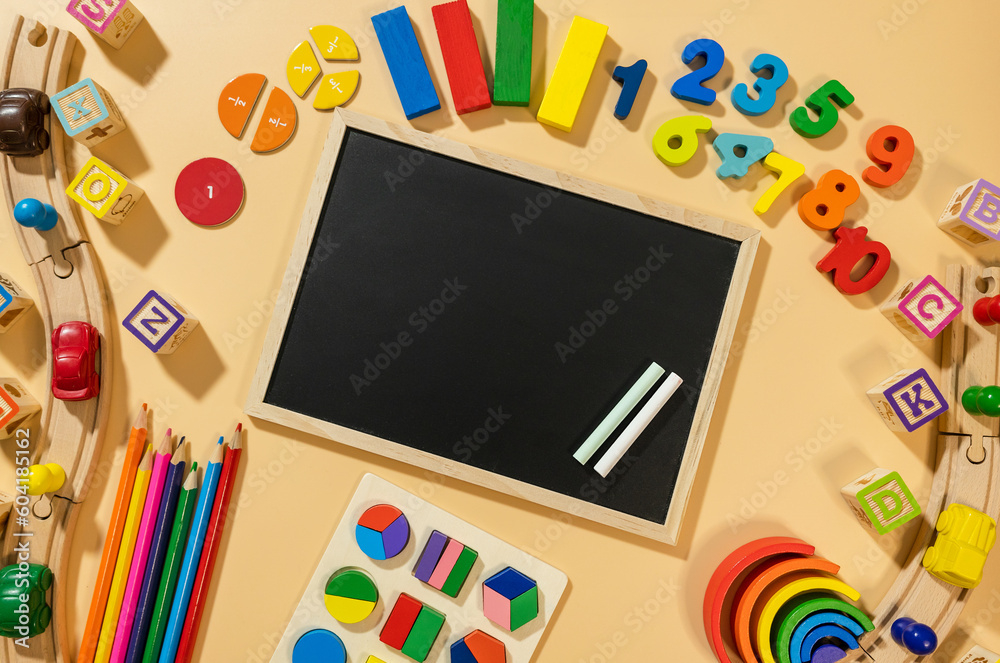 Set of charts on beige background. School blackboard and wooden math fractions on the table. Back to school, creative study for kids, education, mathematics. flat lay Set of charts on beige background. School blackboard and wooden math fractions on the table. Back to school, creative study for kids, education, mathematics. flat lay