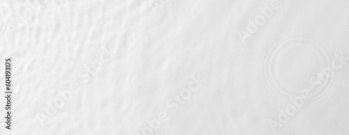 Rippled water with circles on white background, top view. Banner design