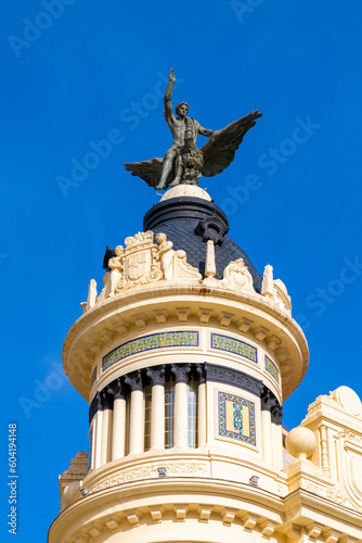 Statue of a Man on a Phoenix on the Union y el Fenix Building in Plaza de las Tendillas by the Architect Benjamin Gutierrez Prieto, Cordoba, Andalusia, Spain photo