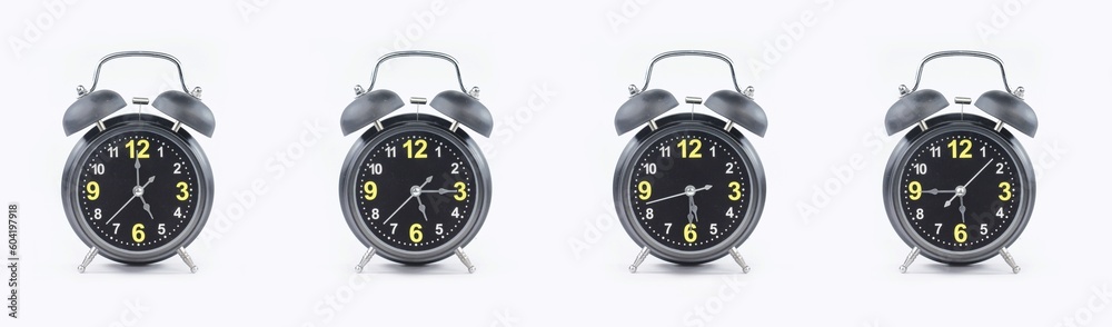 close up of a set of black alarm clocks showing the time; 5, 5.15, 5.30 and 5.45 p.m dan a.m. Isolated on white background
 - obrazy, fototapety, plakaty 