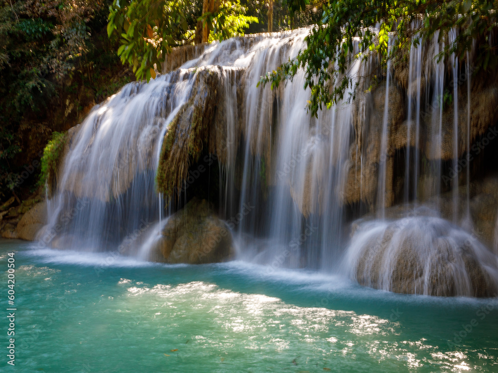 Fototapeta premium Landscape view of Erawan waterfall Kanchanaburi Thailand. Erawan National Park is home to one of most popular falls in Thailand. Second floor of Erawan waterfall Wang Macha