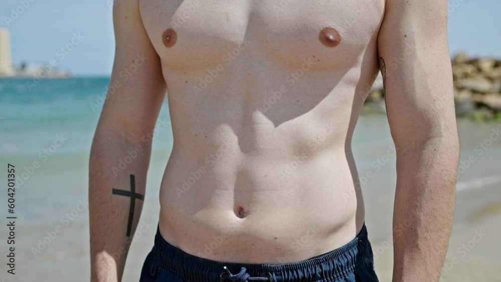 Young hispanic man tourist standing at beach Young hispanic man tourist standing at beach