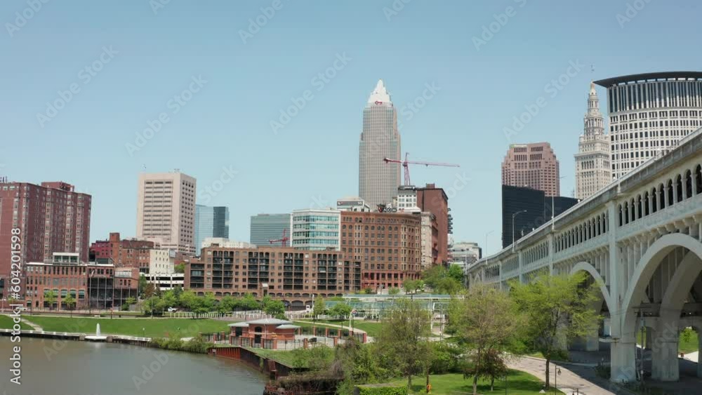 Cleveland Ohio downtown skyline park 4K drone dolly backwards low